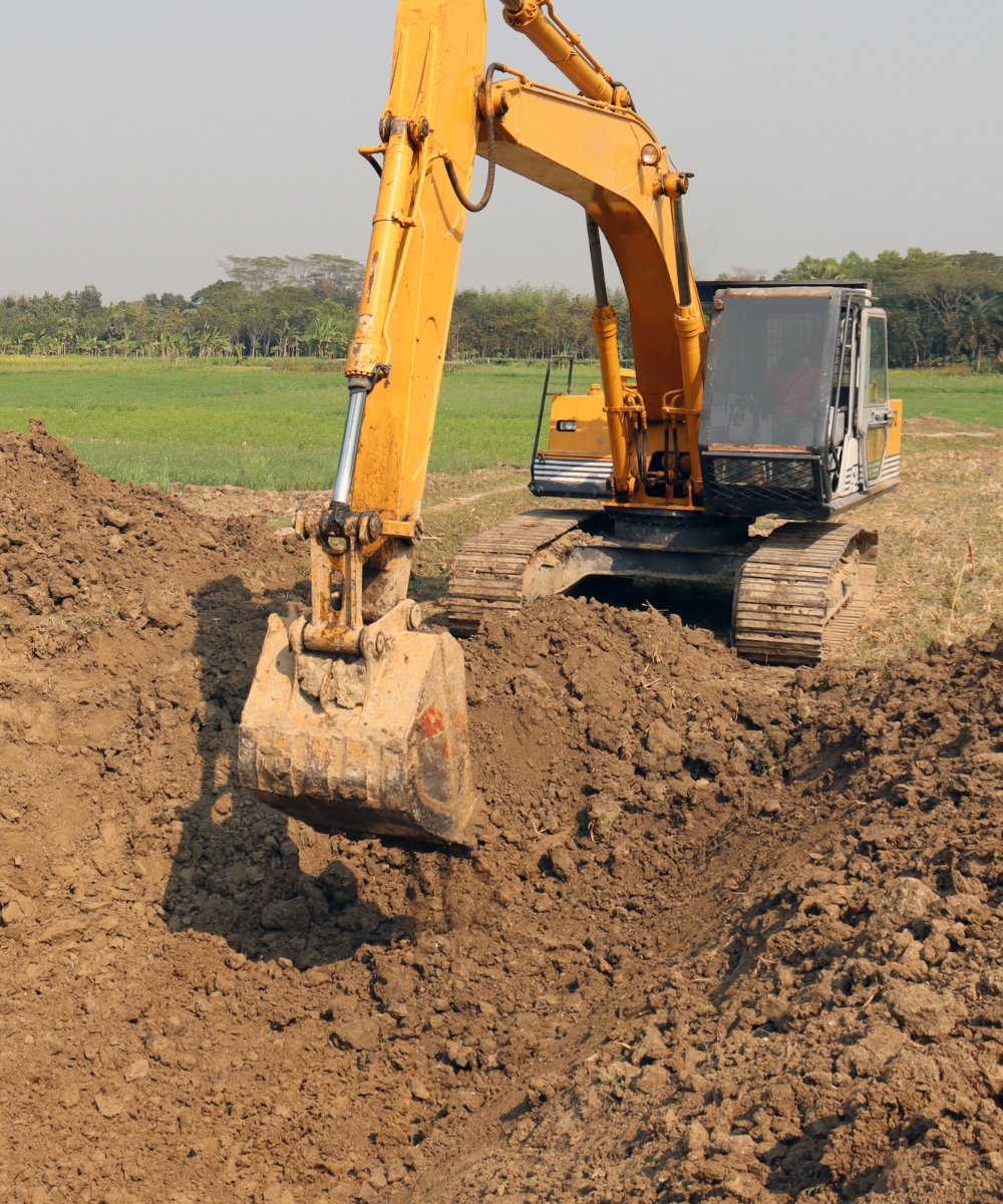 Excavator during excavating & land clearing Lake Placid fl